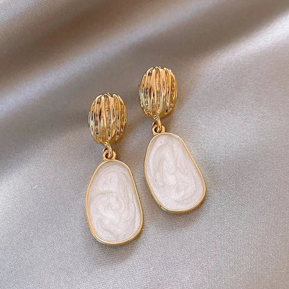 Boucles Ovales™ | Élégance en émail vintage