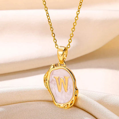 Collier océan plaqué or 18 carats avec initiales au fond de la mer